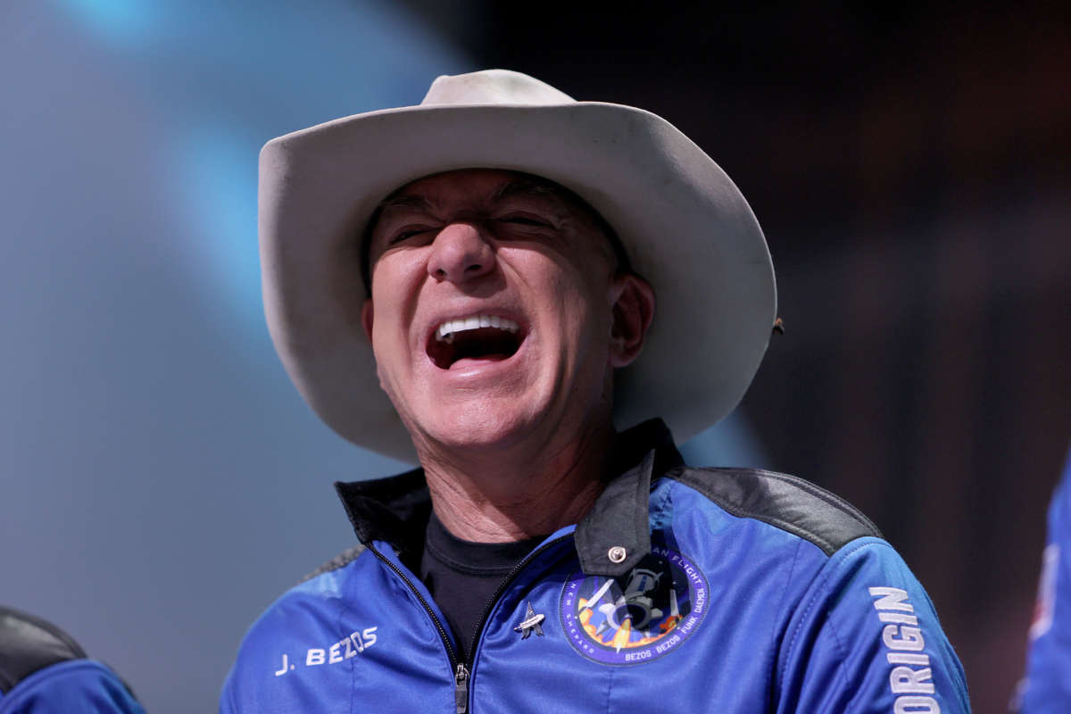 Jeff Bezos laughs as he speaks about his flight on Blue Origin’s New Shepard during a press conference on July 20, 2021, in Van Horn, Texas.