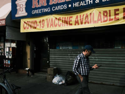 A pharmacy advertises the COVID-19 vaccine in a neighborhood near Brighton Beach on July 22, 2021, in the Brooklyn borough of New York City.