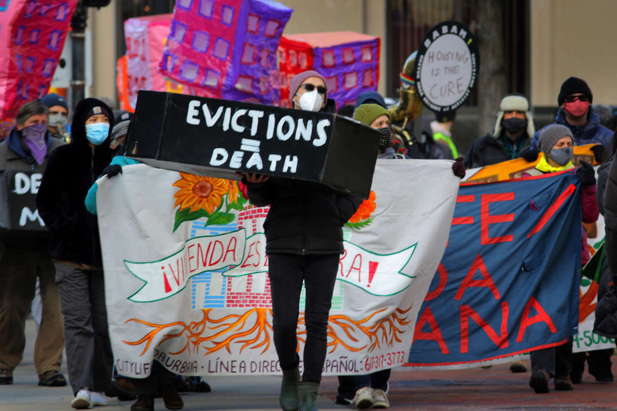 Boston tenants, faith leaders, and small landlords rally and march, calling for a stronger, longer federal eviction ban as part of a National Day of Action to Prevent Evictions in Boston, Massachusetts, on January 13, 2021.