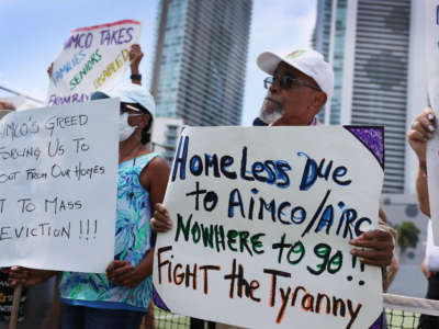 Dr. W. Dean Goldsby Sr. and other tenants of the Hamilton on the Bay apartment building protest eviction notices on June 8, 2021, in Miami, Florida.