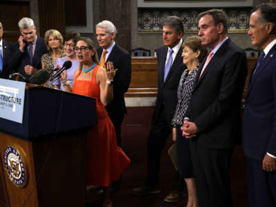 Sen. Kyrsten Sinema speaks during a news conference after a procedural vote for the bipartisan infrastructure framework at Dirksen Senate Office Building on July 28, 2021, on Capitol Hill in Washington, D.C.