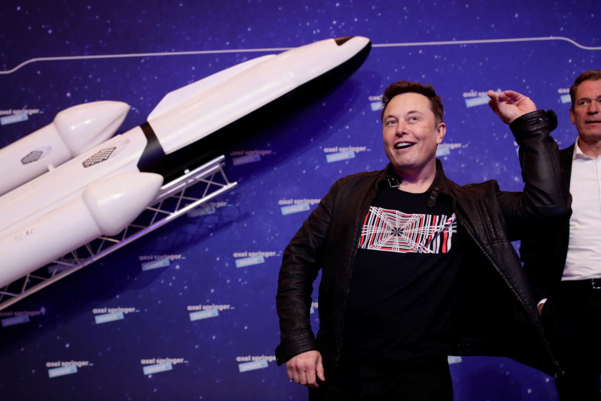 SpaceX owner and Tesla CEO Elon Musk poses next to Axel Springer Board Chairman Mathias Doepfner on the red carpet of the Axel Springer Award 2020 ceremony on December 1, 2020, in Berlin, Germany.