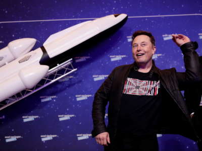 SpaceX owner and Tesla CEO Elon Musk poses next to Axel Springer Board Chairman Mathias Doepfner on the red carpet of the Axel Springer Award 2020 ceremony on December 1, 2020, in Berlin, Germany.