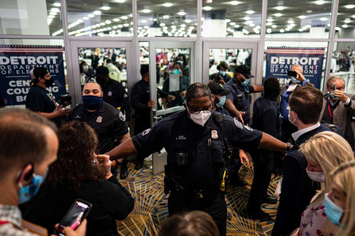 Election challengers demand to enter to observe the absentee ballots counting but were dined after the room reached capacity during the 2020 general election in Detroit, Michigan, on November 4, 2020.