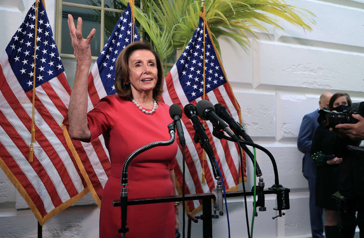 Speaker of the House Nancy Pelosi talks to reporters following the House Democratic caucus meeting at the U.S. Capitol on September 28, 2021, in Washington, D.C.