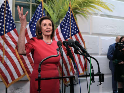 Speaker of the House Nancy Pelosi talks to reporters following the House Democratic caucus meeting at the U.S. Capitol on September 28, 2021, in Washington, D.C.