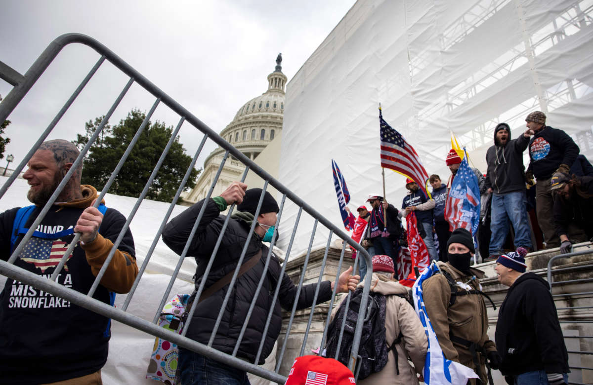 Trump supporters clash with police and security forces as people try to storm the U.S. Capitol in Washington, D.C., on January 6, 2021.