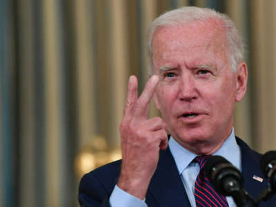 President Joe Biden gestures as he delivers remarks on the debt ceiling from the State Dining Room of the White House on October 4, 2021, in Washington, D.C.