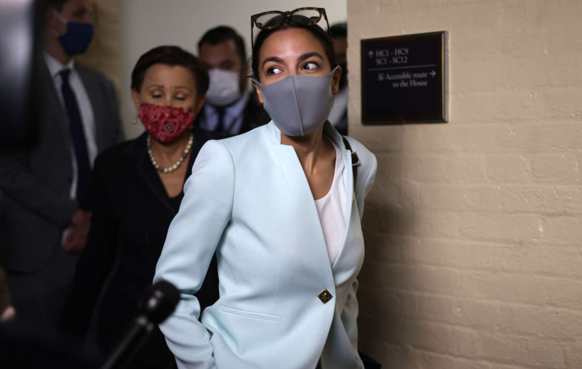 Rep. Alexandria Ocasio-Cortez leaves after a House Democratic Caucus meeting with President Joe Biden at the U.S. Capitol on October 1, 2021, in Washington, D.C.