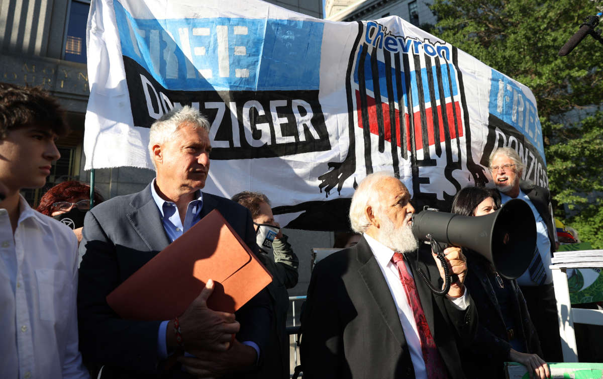 Attorney Steven Donziger, second left, is seen at a rally held in front of the Manhattan Court House ahead of sentencing in a contempt case in New York City on October 1, 2021.