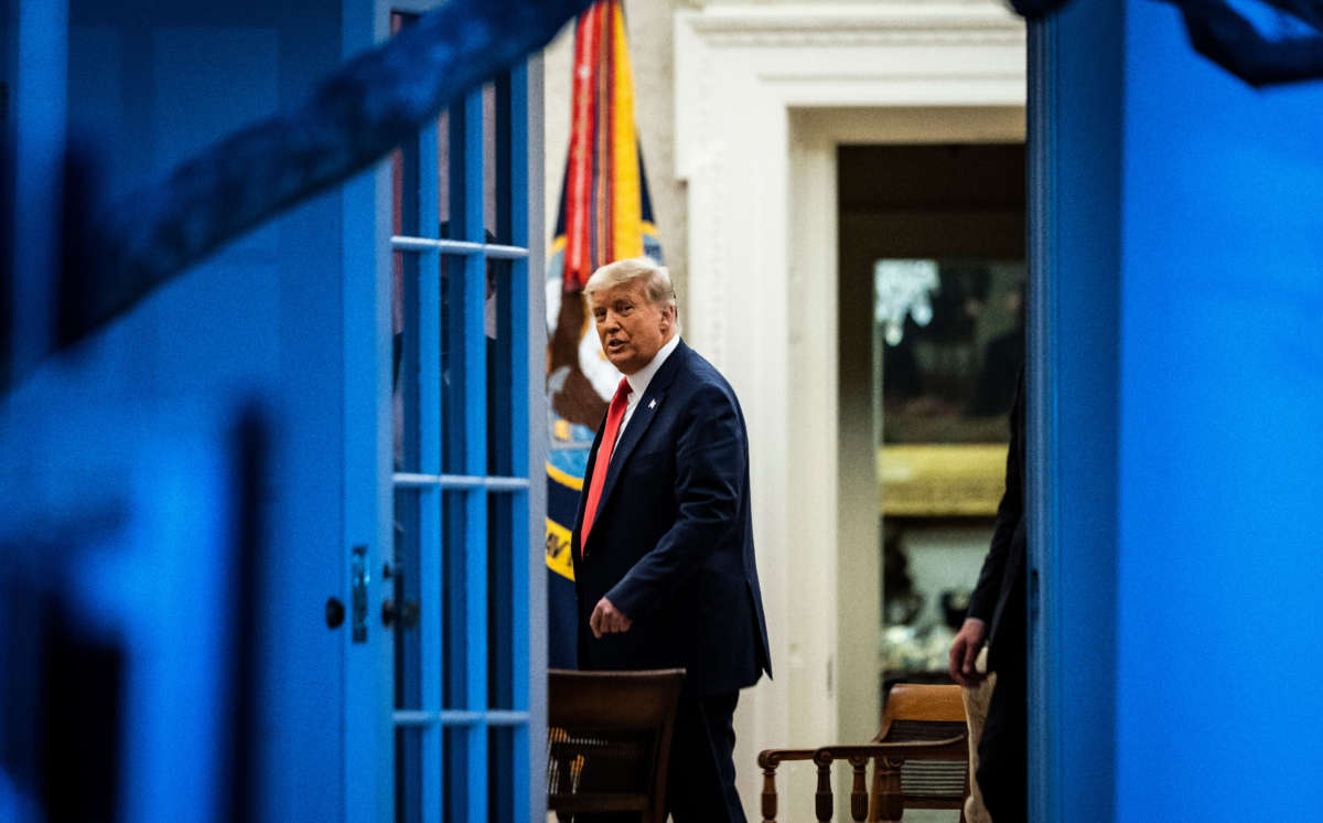 President Donald Trump talks with others in the Oval Office at the White House on November 13, 2020, in Washington, D.C.