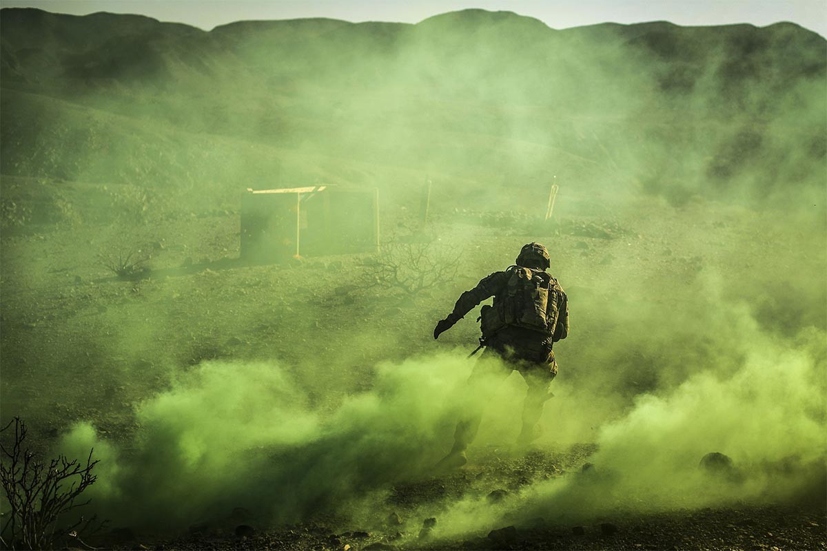 A US soldier maneuvers through a smoke screen during live fire exercises in Djibouti, December 27, 2017.