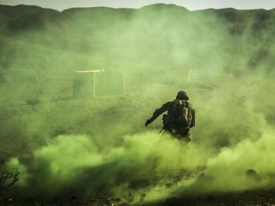 A US soldier maneuvers through a smoke screen during live fire exercises in Djibouti, December 27, 2017.