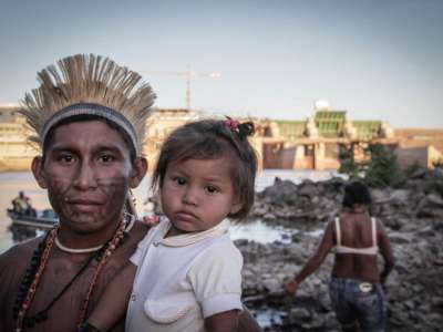Father and child at Munduruku Occupation of Sao Manoel Dam site, Brazil.