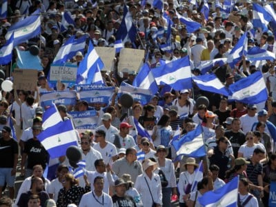 People calling for Nicaraguan President Daniel Ortega to step down protest in Managua, Nicaragua, on April 23, 2018.