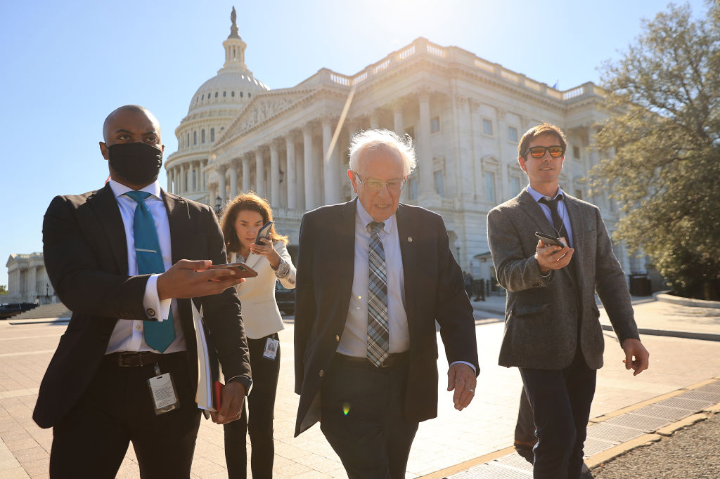 Senate Budget Committee Chairman Bernie Sanders is pursued by reporters as he leaves the U.S. Capitol following votes on September 29, 2021, in Washington, DC.