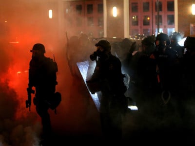 Police deploy tear gas on protesters during a demonstration on November 24, 2014, in Ferguson, Missouri.