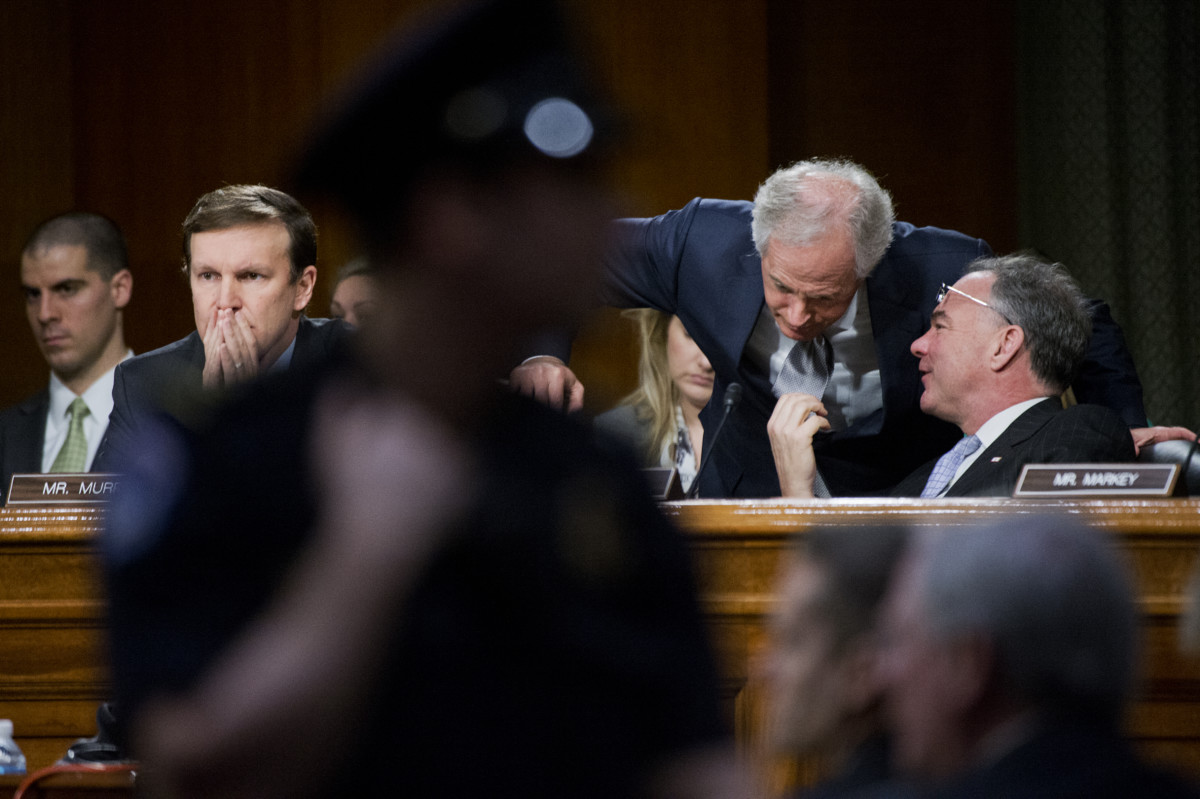 Sen. Bob Corker and Sen. Tim Kaine talk during a Senate Foreign Relations Committee hearing, March 11, 2015. Sens. Corker and Kaine have introduced a new Authorization of Military Force bill to Congress in April 2018.