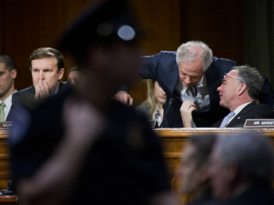 Sen. Bob Corker and Sen. Tim Kaine talk during a Senate Foreign Relations Committee hearing, March 11, 2015. Sens. Corker and Kaine have introduced a new Authorization of Military Force bill to Congress in April 2018.