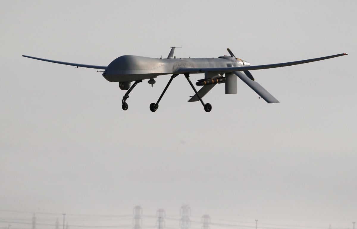 A US Air Force MQ-1B Predator unmanned aerial vehicle carrying a Hellfire missile lands at a secret air base after flying a mission in the Persian Gulf region on January 7, 2016.