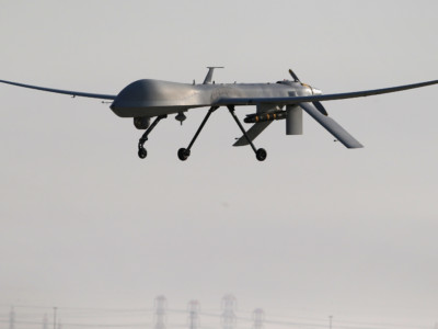 A US Air Force MQ-1B Predator unmanned aerial vehicle carrying a Hellfire missile lands at a secret air base after flying a mission in the Persian Gulf region on January 7, 2016.