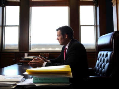 Kansas Secretary of State Kris Kobach discusses the Kansas proof of citizenship requirements for voter registration in his office in Topeka, Kansas, February 17, 2015.