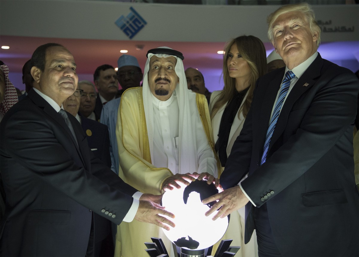 Donald Trump, Saudi Arabia's King Salman bin Abdulaziz al-Saud (2nd L) and Egyptian President Abdel Fattah el-Sisi (L) put their hands on an illuminated globe during the inauguration ceremony of the Global Center for Combating Extremist Ideology in Riyadh, Saudi Arabia, on May 21, 2017.