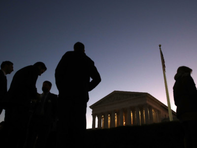 People wait in line to attend the fall session of the US Supreme Court, on October 2, 2017, in Washington, DC.