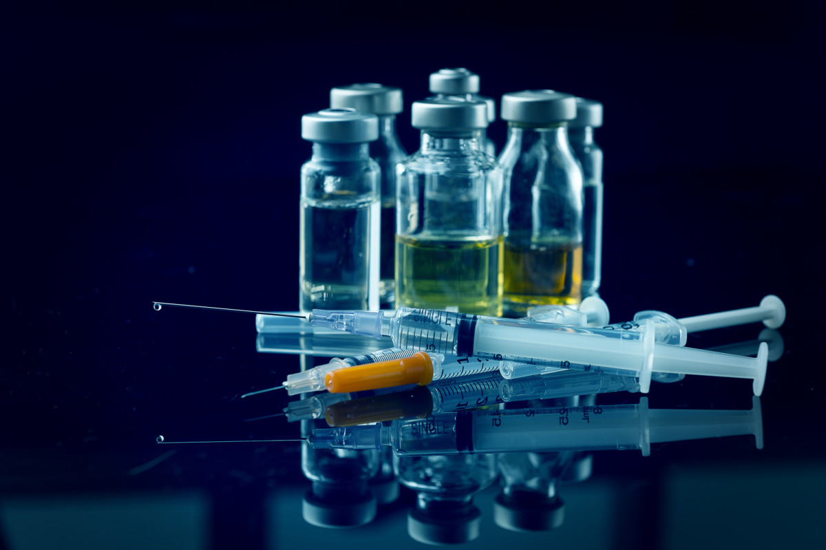 Close up shot syringe and Vial bottle with black background medical equipment concept