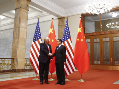 US President Donald Trump shakes hands with Chinese Premier Li Keqiang during a meeting at the Great Hall of the People in Beijing on November 9, 2017.