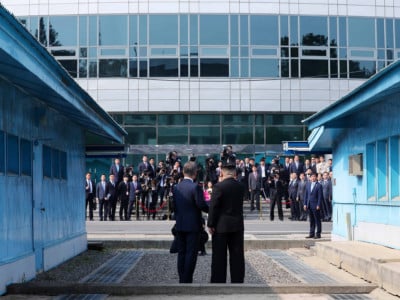 North Korean Leader Kim Jong Un and South Korean President Moon Jae-in shake hands over the military demarcation line upon meeting for the Inter-Korean Summit on April 27, 2018, in Panmunjom, South Korea.