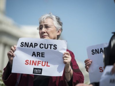 Supporters listen as Rep. Donald McEachin holds a news conference with faith leaders to "urge lawmakers to reject proposed cuts to the Supplemental Nutrition Assistance Program in the Farm Bill" on Monday, May 7, 2018.