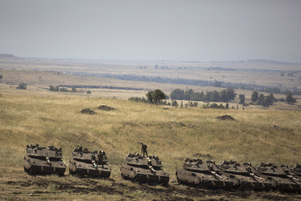 Israeli Merkava tanks are deployed near the Israeli-Syrian border on May 10, 2018, in the Israeli-annexed Golan Heights.