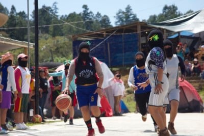 Zapatista women playing basketball during their first “encounter” for women.