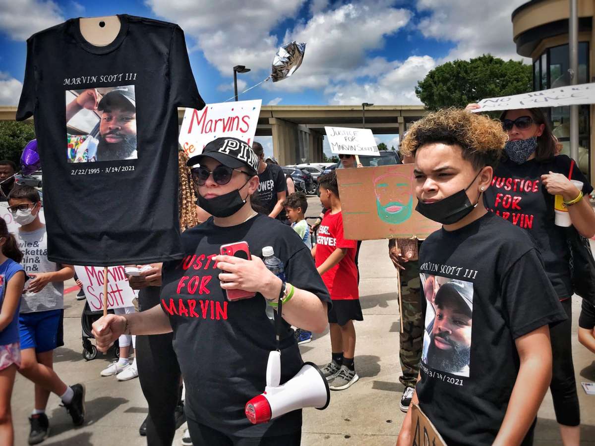 Demonstrators gather in Plano, Texas, to protest the in-custody homicide of Marvin Scott III on May 2, 2021.