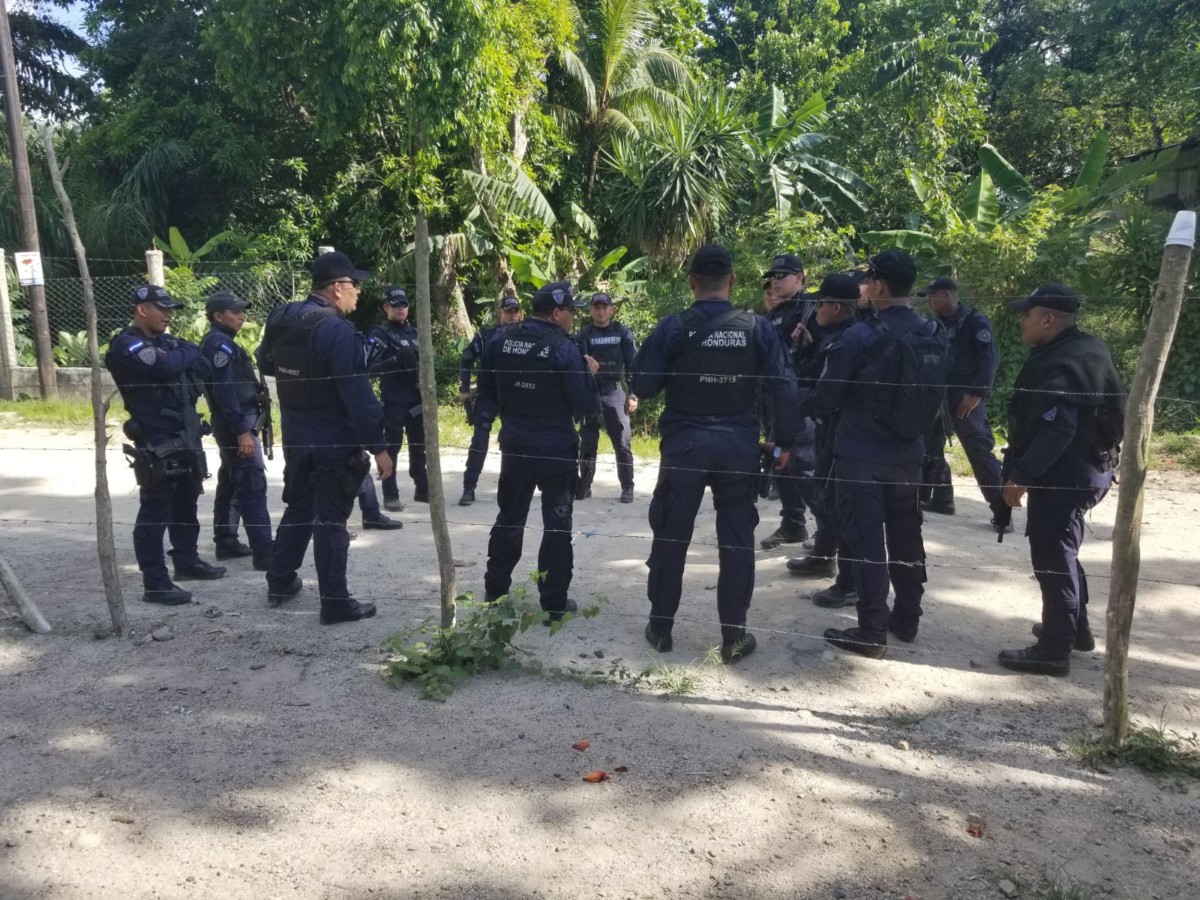 TIGRES and other police unit members maintain a presence May 3 near the Pajuiles protest camp along the road leading to a contested dam construction site.