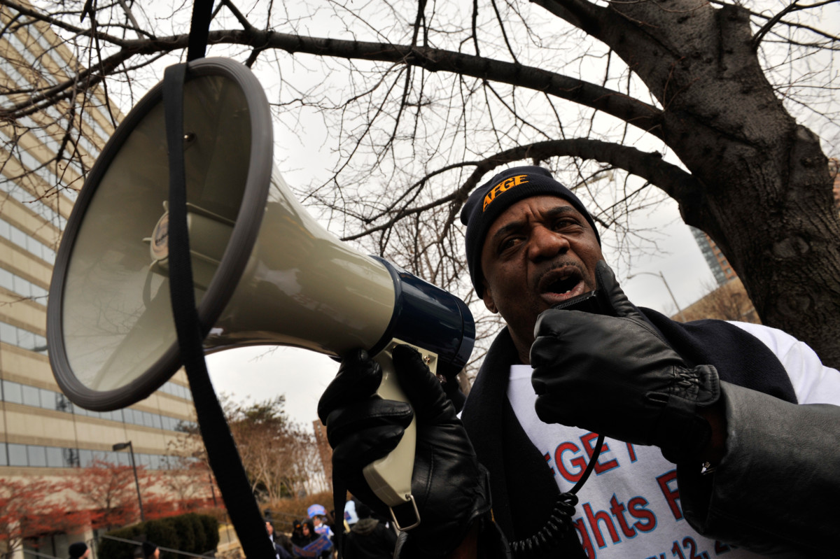 An American Federation of Government Employees union member protests outside the Transportation Security Administration headquarters on February 24, 2014.