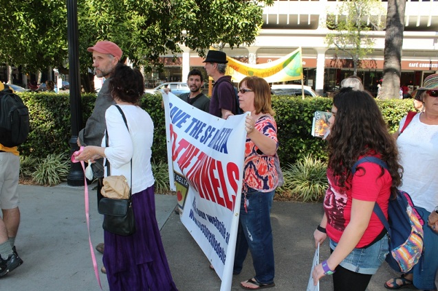 Javier Padilla, Barbara Barrigan-Parrilla and Kate Parrilla of Restore the Delta march around the State Capitol to protest Governor Jerry Brown's plan to frack California and build the peripheral tunnels. (Photo by Dan Bacher)