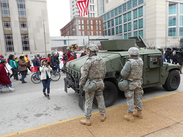 November 26, 2014: The National Guard watches as march to city hall goes by. (Photo:  Larry Everest / revcom.us)