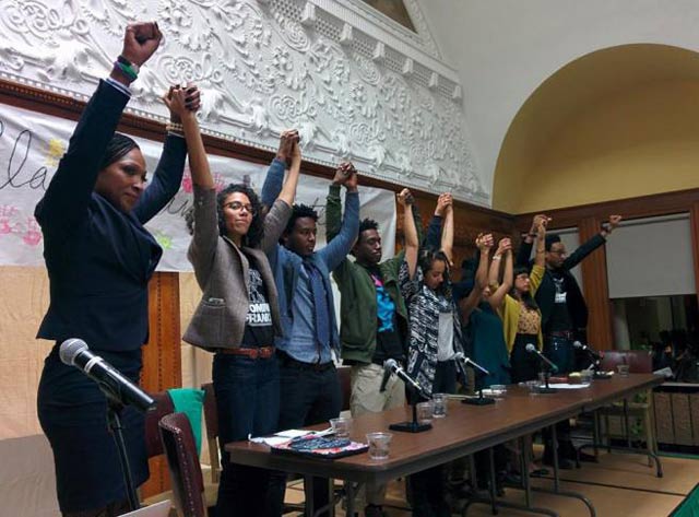 The We Charge Genocide Geneva delegation and W.A.P.B. Geneva delegate Monica James at a community report back about their trip. (Photo: Kelly Hayes)