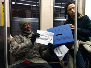 Another commuter rejects Rahm Emanuel in support of the reparations ordinance. (Photo: Kelly Hayes)