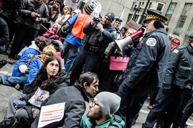 Mass arrest during the campaign to prevent Rahm Emanuel from closing 50 schools, 80% of which were located in black communities. The schools were subsequently closed, despite months of protest. (Photo: Sarah Jane Rhee)
