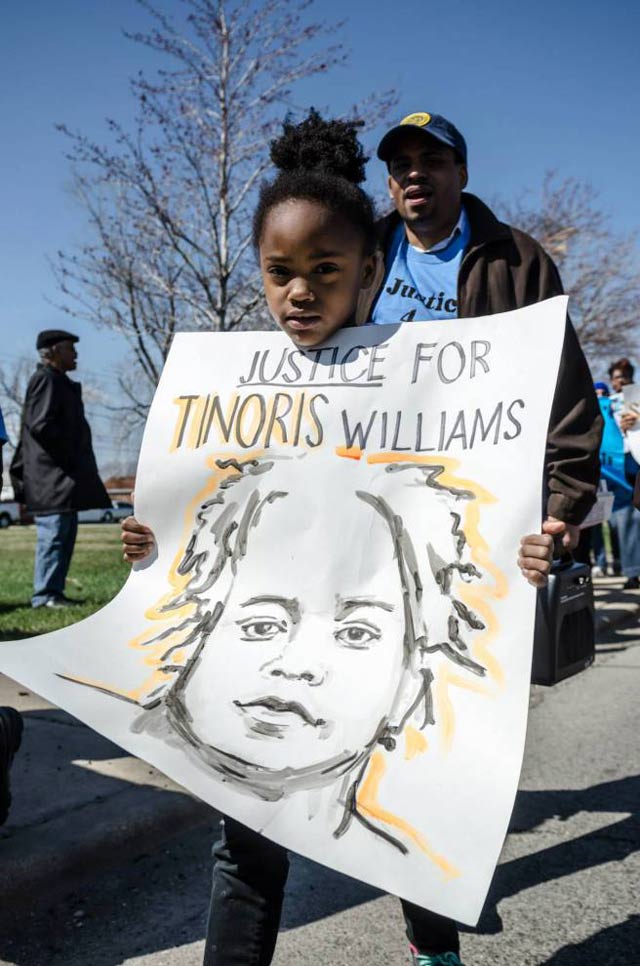 VLA students carried signs bearing the names and images of neuroatypical and mentally ill individuals who have been killed by police. The students have made a project of studying the relationship between ableism and police violence. (Photo: Sarah Jane Rhee)