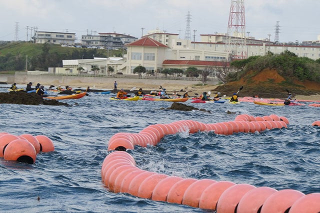 The canoe activists at the orange-buoy cordon. (Photo: Courtesy of Hakim)