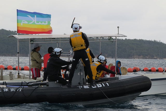 The Japanese Coast Guard approaching another Peace Boat  on which were two other Okinawa Peace Walk participants. (Photo: Courtesy of Hakim)