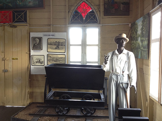 An exhibit at the West Indian Museum of Panama, residing in an old church, depicts wagons used to move earth during the digging of the Panama Canal. (Photo: Zach Borenstein)