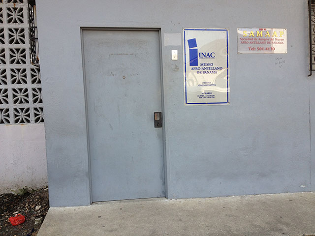 The entrance to the offices of The West Indian Museum of Panama and SAMAAP, The Society of Friends of the Museum. Paint is fading, the façade is visibly dirty, there is writing on the wall and trash can be seen in the picture. SAMAAP feels the Panamanian government has allocated insufficient funds to maintain the museum. (Photo: Zach Borenstein)