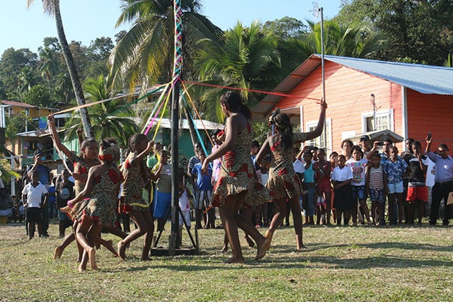 Local school girls dance around the May Pole for President Varela in Bastimentos, Panama. (Photo: Los Cuatros Photo Team)