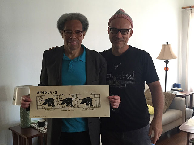 Albert and Rigo 23, with the latest artwork from Rigo 23 illustrating that all of the Angola 3 are Free.