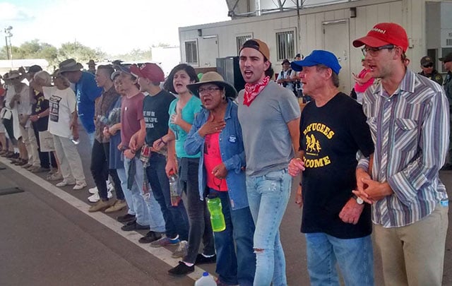 Activists holding the line at Border Patrol checkpoint. (Photo: SOAW Facebook)